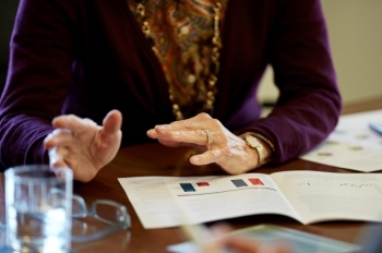 financial advisors hands at conference table